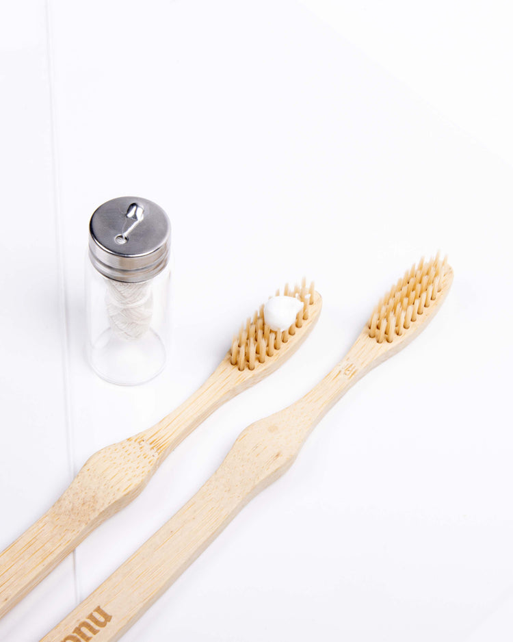 Bamboo toothbrush with natural toothpaste and floss